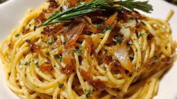 Caramelized onion and garlic spaghetti tossed with golden onions, roasted garlic, olive oil, and fresh herbs.