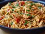 Chicken one pot spaghetti with tender pasta, juicy chicken, tomato sauce, and fresh herbs served in a skillet.