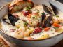 Bowl of Nova Scotia seafood chowder with shrimp, scallops, and fish in creamy broth