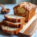 Sourdough discard cinnamon quick bread sliced with visible cinnamon swirl