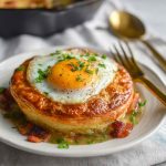 Rise and Shine breakfast pot pie filled with eggs, cheese, bacon, and vegetables baked in a golden flaky crust.