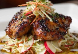 Sticky apple cider chicken glazed with sweet and tangy cider sauce, served alongside crisp autumn slaw with fresh apples and cabbage.
