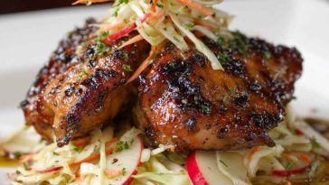 Sticky apple cider chicken glazed with sweet and tangy cider sauce, served alongside crisp autumn slaw with fresh apples and cabbage.