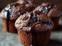 Double chocolate muffins with rich cocoa flavor, gooey melted chocolate chips, and a moist, fluffy texture served warm.