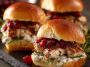 Cranberry turkey sliders made with tender turkey, melted cheese, cranberry sauce, and soft slider buns baked golden brown.