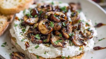 Whipped ricotta topped with balsamic marinated mushrooms, fresh herbs, and a drizzle of olive oil served on crusty bread.