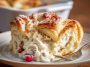 Cheesecake crescent rolls casserole baked golden brown, with creamy cheesecake filling layered between buttery crescent dough.