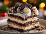 Layered no-bake Oreo Christmas lasagna topped with whipped cream and festive sprinkles.