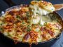 Scalloped potatoes baked with layers of tender sliced potatoes and creamy cheesy sauce, topped with golden crust.