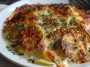 Crispy parmesan and gruyere potato gratin baked golden brown in a casserole dish