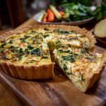 Winter vegetable quiche baked golden brown with seasonal root vegetables, creamy ricotta, and fresh herbs in a flaky crust.