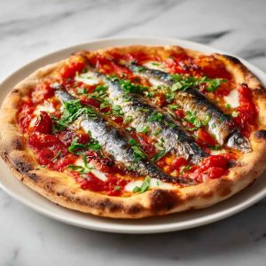 Sardine margherita pizza topped with mozzarella, basil, and fresh sardines