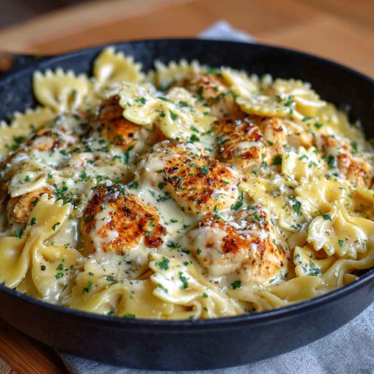 Bowtie pasta with garlic butter chicken coated in mozzarella cream sauce