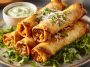 Crunchy oven-baked chicken taquitos filled with shredded chicken, melted cheese, and golden crispy tortillas.