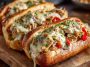 Juicy chicken Philly cheese steaks loaded with sautéed peppers, onions, and melted provolone in a toasted hoagie roll.