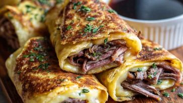 “Golden baked French dip tortilla roll ups filled with roast beef, melted cheese, and served with au jus dipping sauce.”
