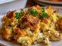 Golden chicken and stuffing casserole baked in a rustic dish.