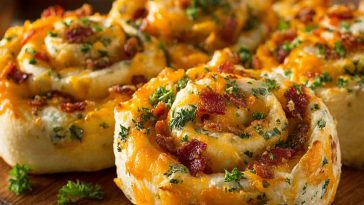 “Cheddar bacon ranch pinwheels sliced into bite-sized spirals, filled with creamy ranch, melted cheddar, and crispy bacon.”