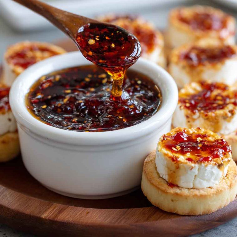 Quick pepper jelly cream cheese appetizer dip and bite-sized snacks served on crackers.