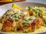 Golden lemon chicken Romano topped with Parmesan cheese, served with fresh herbs and a zesty lemon sauce.