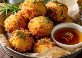 Golden Southern-style honey butter cornbread poppers, bite-sized, fluffy inside with a sweet buttery glaze.