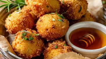 Golden Southern-style honey butter cornbread poppers, bite-sized, fluffy inside with a sweet buttery glaze.