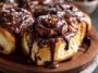 Irresistible chocolate cinnamon rolls drizzled with melted chocolate glaze, swirled with rich cocoa and cinnamon filling.