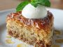 "Moist baklava cake topped with crunchy nuts, honey syrup drizzle, and golden flaky layers."