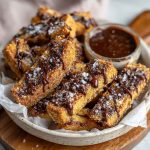 Crunchy homemade brown butter chocolate chip cookie fries served in a basket with dipping chocolate sauce, golden and crispy on the edges.