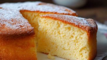 “A golden light and fluffy sponge cake with airy texture, topped with powdered sugar and fresh berries.”