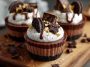 Oreo chocolate mousse cups layered with crushed Oreos, creamy chocolate mousse, and whipped topping in a glass.