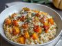 Creamy roasted butternut squash risotto with golden squash cubes, Parmesan cheese, and fresh herbs served in a cozy bowl.