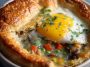 Golden breakfast pot pie filled with garlic ranch mashed potatoes, eggs, and cheese.