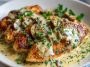 “Pan-seared chicken breast topped with rich Irish whiskey cream sauce, garnished with parsley and served with mashed potatoes.”
