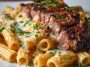 "Cajun steak cheesy rigatoni parmesan baked in a skillet, topped with melted cheese, herbs, and tender steak slices."