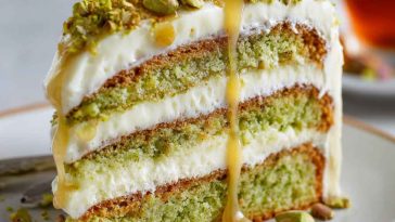 Elegant pistachio mascarpone layer cake with fluffy sponge, creamy mascarpone frosting, and crushed pistachio topping.