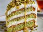 Elegant pistachio mascarpone layer cake with fluffy sponge, creamy mascarpone frosting, and crushed pistachio topping.
