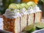 Best key lime angel food cake topped with fluffy whipped cream, fresh lime zest, and light airy texture.
