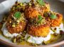Golden sweet potato croquettes served with burrata dip and sprinkled with pistachio crunch.