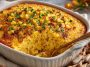 Golden honey glazed corn casserole baked to perfection, with a sweet glaze and fluffy texture served in a rustic dish.