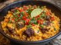 "Easy steak queso rice served in a skillet with tender steak bites, creamy queso sauce, and fluffy rice topped with fresh cilantro."