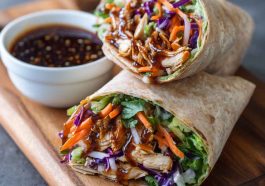 "Fresh teriyaki chicken wrap filled with grilled chicken, crisp lettuce, colorful veggies, and drizzled with teriyaki sauce."