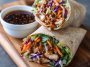 "Fresh teriyaki chicken wrap filled with grilled chicken, crisp lettuce, colorful veggies, and drizzled with teriyaki sauce."