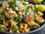 Mexican street corn Brussels sprouts roasted until crispy, tossed with creamy sauce, cotija cheese, lime, and chili powder.