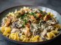 A creamy chicken stroganoff served over egg noodles, garnished with fresh parsley in a rustic bowl.