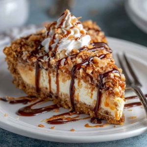 "Samoas pie topped with toasted coconut, drizzled with caramel and chocolate, and layered on a buttery crust."