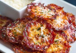 "Crispy baked pepperoni and cheese crisps served on a tray, golden and crunchy with melted cheese."