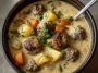 "Cozy Swedish meatball soup served in a rustic bowl with creamy broth, tender meatballs, and fresh herbs."