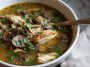 Cozy bowl of rotisserie chicken and mushroom soup, hearty fall comfort food with fresh herbs.