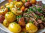 A hearty slow cooker dish with tender garlic butter beef and golden potatoes, garnished with fresh herbs.